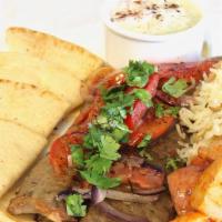 Gyro Plate · sliced Gyro meat, grilled tomato and onions with a choice of lemon potatoes or Greek rice an...