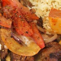 Filet Mignon Souvlaki · 2 skewers Grilled beef steak, grilled tomatoes and onions with a choice of lemon potatoes or...