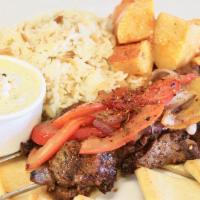 Lamb Souvlaki · 2 Grilled lamb skewer, grilled tomatoes and onions with a choice of lemon potatoes or Greek ...