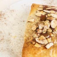 Galaktobouriko · semolina pudding wrapped in fillo dough with honey and almonds topping