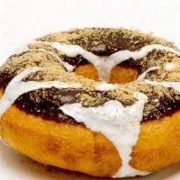 S'More Donut · Chocolate icing, topped with graham cracker crumbs and a marshmallow drizzle.