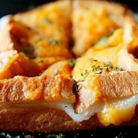 Garlic Cheese Toast · Milkie milkie’s toast is crispy outside with homemade soft rice cake inside. Topping: cheese...