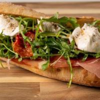 Dolce Vita · Prosciutto Di Parma , Fresh mozzarella . Roasted cherry tomatoes , Arugula on a baguette