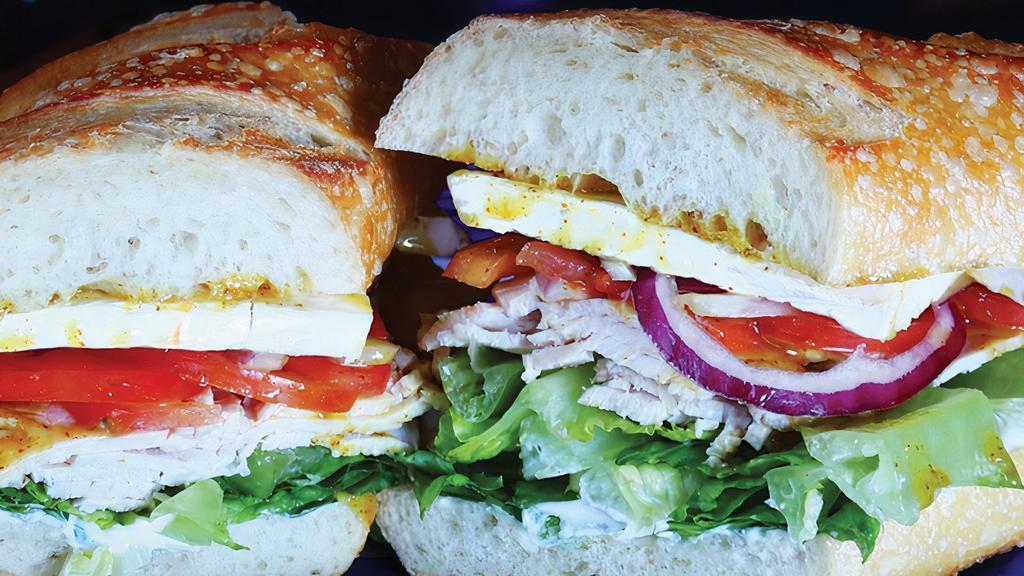 Bart'S Bag · Turkey, brie, lettuce, tomato, red onion, honey mustard, mayonnaise on a Baguette. 🦷Crusty Bread