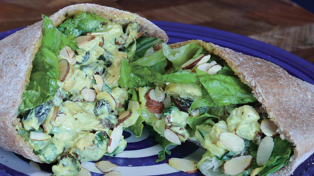 Kalid'S Kurry Pita · Curry chicken salad, toasted almonds, lettuce in a Wheat Pita.