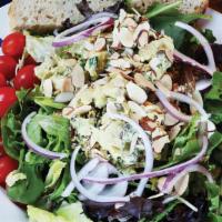 Larry, Moe & Kurry · Curry chicken salad, toasted almonds, cucumber, tomato, red onion, Vinaigrette dressing on m...