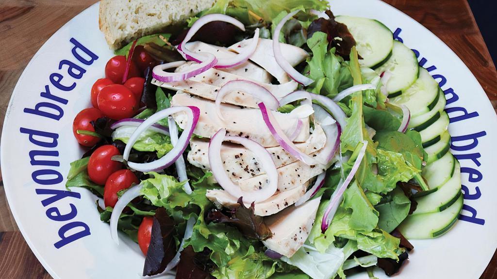 Let'S Play Chicken · Chicken, cucumber, tomato, red onion, Ranch dressing on mixed greens