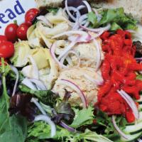 Three'S Crowd · Hummus, artichoke hearts, roasted red peppers, cucumber, tomato, red onion, Vinaigrette dres...