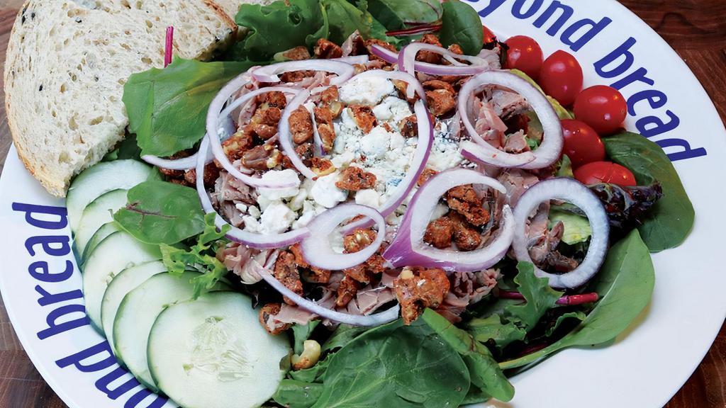 Angus Management · Roast Beef, spiced cinnamon walnuts, crumbled gorgonzola, cucumber, tomato, red onion, Italian dressing on mixed greens.