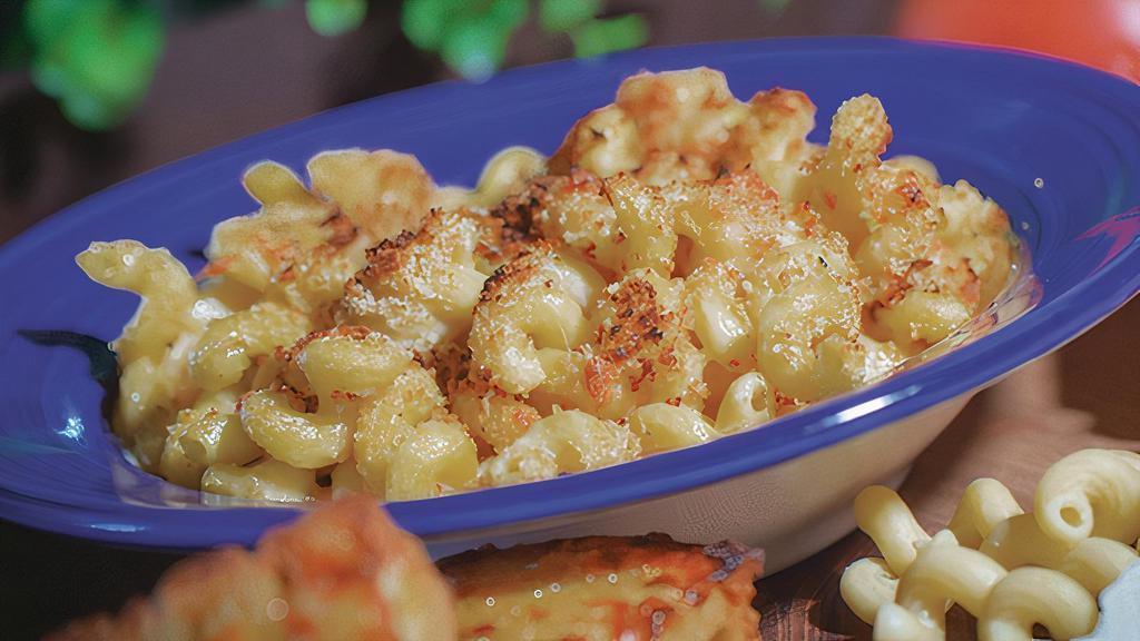 Classic Mac And Cheese · Made to order cellentani pasta with a white cheddar and Parmesan sauce, and house-made Italian bread crumbs with toasted garlic bread.