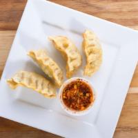 Vegetable Gyoza · Hana's vegetable dumpling served with a spicy soy sauce.