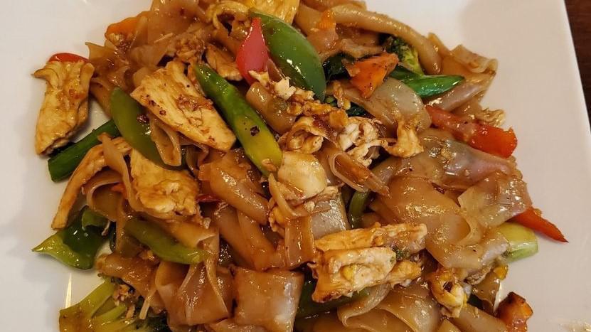 - Drunken Noodles · Stir fried wide rice noodles with egg, Chinese broccoli, carrot, bell pepper, basil and tomatoes.