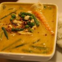 - Panang Curry · Gluten-free. Panang curry simmered with coconut milk, bell pepper, green bean, basil leaves,...