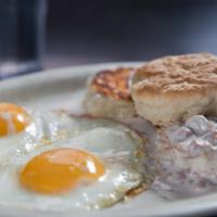 Biscuits And Gravy · A giant fluffy buttermilk biscuit covered in our country sausage gravy. With 2 scrambled eggs.