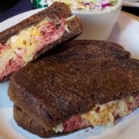 Reuben Sandwich · Served on grilled marbled rye with fresh corned beef, sauerkraut, swiss and 1000 island dres...