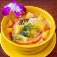 Mango Curry · Panang curry with coconut milk, fresh mango. cashew nuts, peas & carrot, bell peppers and br...