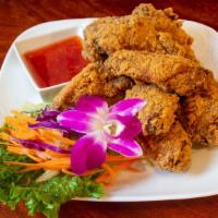 Angel Wings · Deep fried marinated chicken wings, served with sweet and chili sauce.