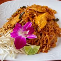 Pad Thai · Thin rice noodles stir-fried with egg, bean sprouts and scallion onions, served with ground ...