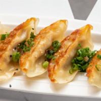 Gyoza · Pan-seared pork and vegetable dumplings
