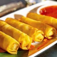 Spring Rolls · Deep-fried vegetable spring rolls served with house-made sweet and sour sauce