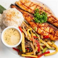 Miso Glazed Salmon · Grilled salmon served with steamed rice, grilled vegetables, and a miso oregano sauce.  Incl...