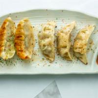 Gyoza (6 Pc) · Steamed / pan seared pork and veggie potstickers, served with ponzu on the side.