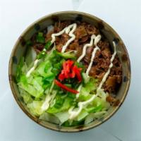 Gydon Beef · Thinly sliced beef and onion marinated in a sweet sukiyaki sauce on top of a bed of rice wit...
