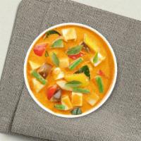 Yellow Opulence · Simmered in yellow curry spices with coconut milk, potato, onion, and carrot. Served with wh...