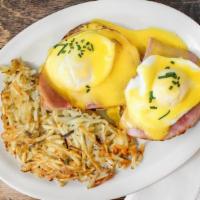 The Usual Suspect · Ham and two poached eggs on English muffins with hollandaise.