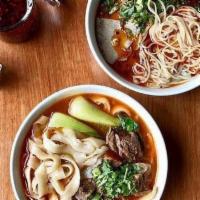 Beef Rice Noodles In Soup 麻辣牛肉米线 · Mild spicy level one star