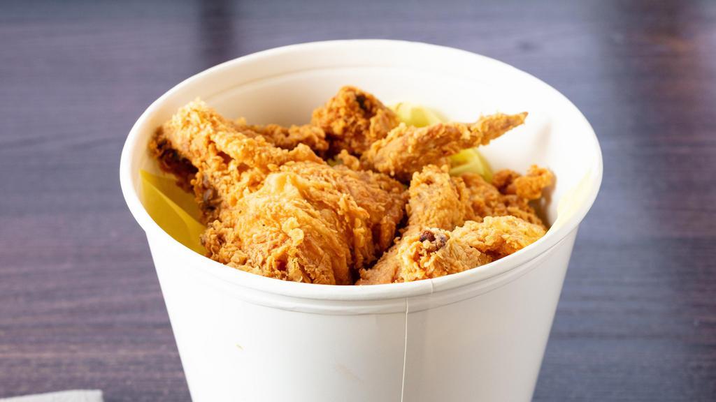 Chicken Bucket - 8 Pieces (Small) · Served with one side: waffle fries, coleslaw or mashed potatoes.