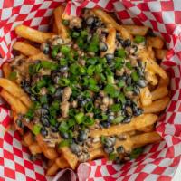 Loaded Fries · Cheese sauce, black beans, steak, green onions.