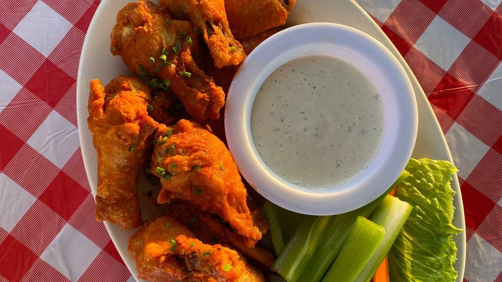 Chicken Wings · Carrots, celery, choice of ranch or bleu cheese, tossed in honey sriracha, whisky BBQ sauce, buffalo sauce, spicy, or garlic parmesan.