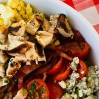 Cobb Salad · Seasoned diced chicken, bacon, cherry tomatoes, egg, bleu cheese, red wine vinaigrette
