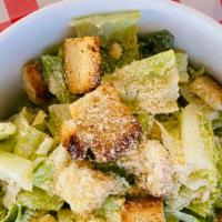 Caesar Salad · Romaine hearts, caesar dressing, croutons and cheese.