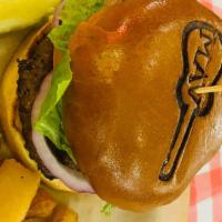 Maverick Burger · Double 1/4 lb patty , cheddar cheese, lettuce, onion and tomato.