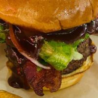 Whiskey Burger · Double 1/4 lb patty, bacon, Jack Daniel's BBQ sauce, lettuce, onion and tomato.