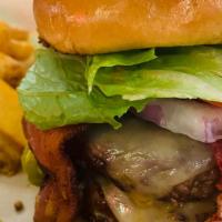 Hatch Green Chile Burger · Double 1/4 lb patty , spicy Pepper Jack cheese, 2 strips of bacon, lettuce, onion and tomato.