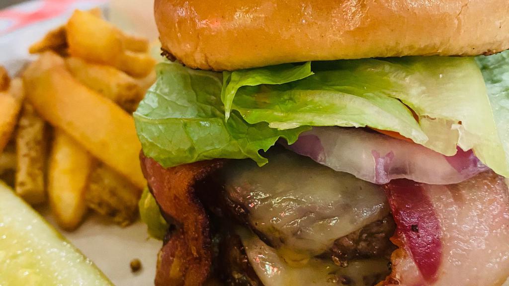 Hatch Green Chile Burger · Double 1/4 lb patty , spicy Pepper Jack cheese, 2 strips of bacon, lettuce, onion and tomato.