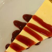 Ny Cheesecake · Chocolate or raspberry topping.