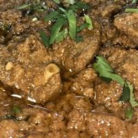 Bhuna Gosht · Lamb cooked with onion, ginger, garlic, tomatoes and whole spices.