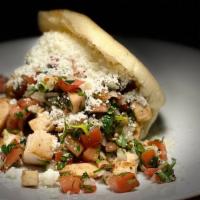# 7 Arepa Asada De Pollo / Chicken · Roasted arepa with grilled chicken, pico de gallo, mayonnaise and Cotija cheese