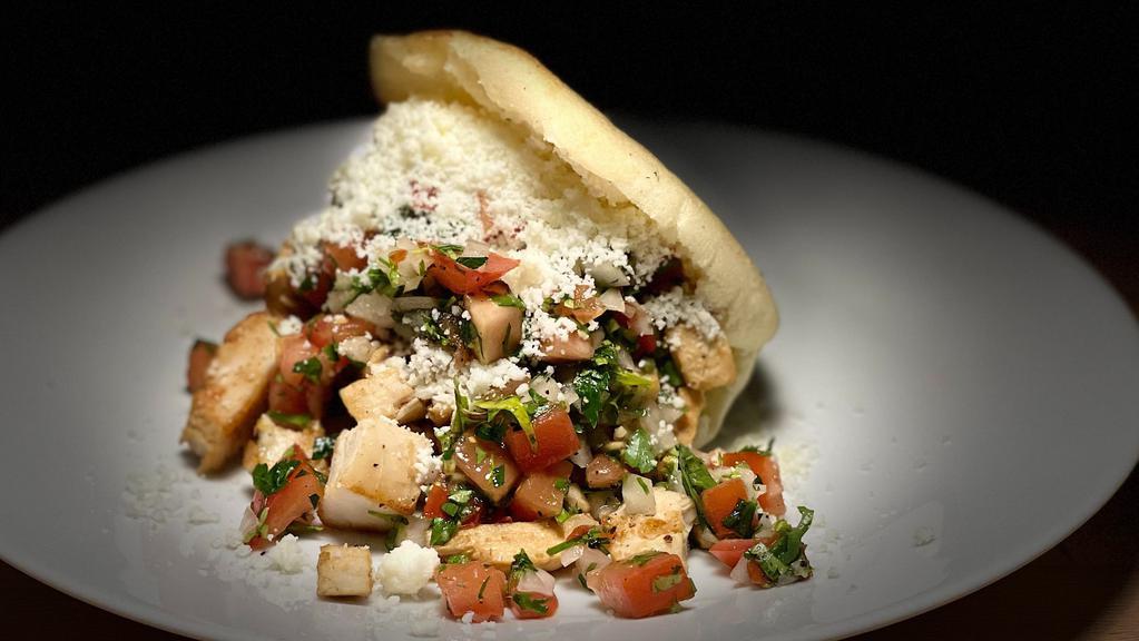 # 7 Arepa Asada De Pollo / Chicken · Roasted arepa with grilled chicken, pico de gallo, mayonnaise and Cotija cheese
