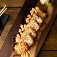 South Of The Border Roll* · Salmon, crab mix, jalapenos and cream cheese, lightly panko'd, topped with spicy mayo and ee...