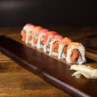 Tiger Roll · Spicy tuna, cucumber and avocado topped with tuna and salmon.
