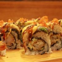 Dragon Roll (8 Pcs) · Temp. shrimp, BBQ eel, cucumber, avo., spicy sauce, eel sauce, masago, seeds.