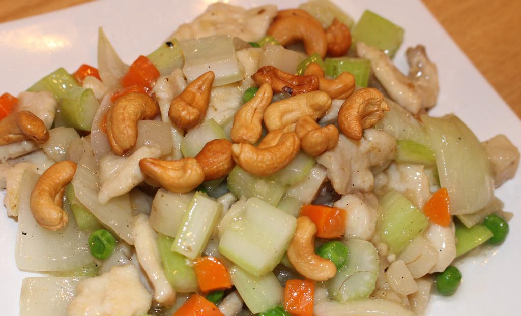 Cashew Nut  · stir-fried with assorted vegetable in light souce with cashew nuts on top