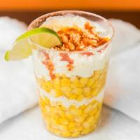 Elote En Vaso · shredded white mexican corn in a cup.  Topped with mayonnaise, cheese, chili and butter.