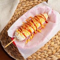 Elote Entero · Mexican white corn on a cob. Topped with mayonnaise, cheese, chili and butter
