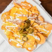 Mochis Nachos · Classic Nachos from Los Mochis with Chili Bean Sauce, sour cream, shredded cheese and jalape...